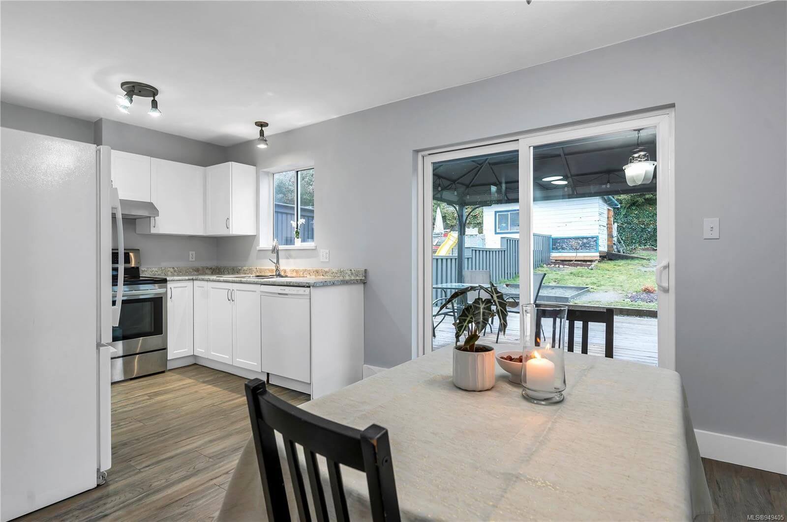 Beautiful kitchen with fresh gray paint and white cabinets
