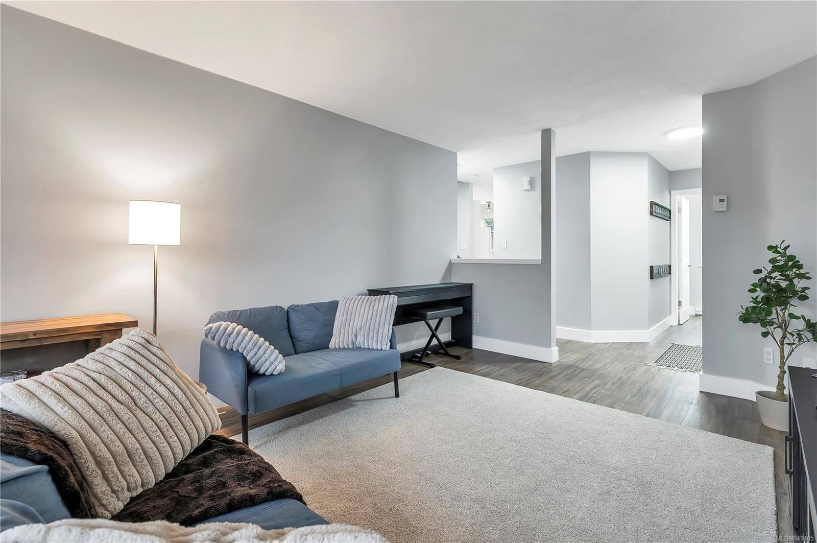 Transformed living room with professional sage gray paint